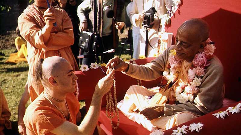 Hare Krishna devotee bowing to a false master 